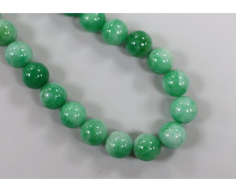 A single strand jade bead necklace, with white metal clasp, beads approximately 14mm in diameter, 44cm.