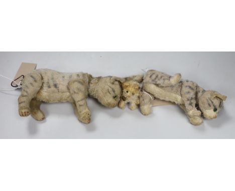 A Steiff Mini 'fluffy' cat, button, ribbon and bell, c.1925, 3in., some hair loss, and two Steiff cats, moveable heads, 1950'