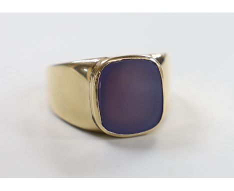 A modern 9ct gold and chalcedony set signet ring, size R, gross weight 15.8 grams.