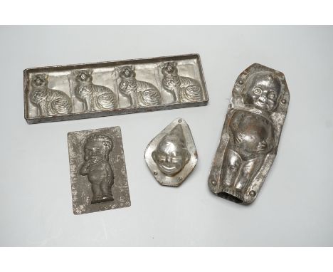 Four chocolate mould tins: a cat, a kewpie and two others