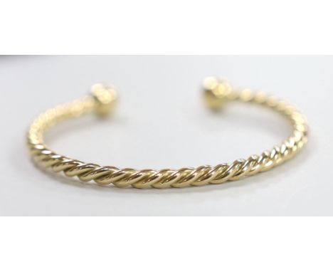 A modern 9ct gold rope twist bangle, 22.1 grams.