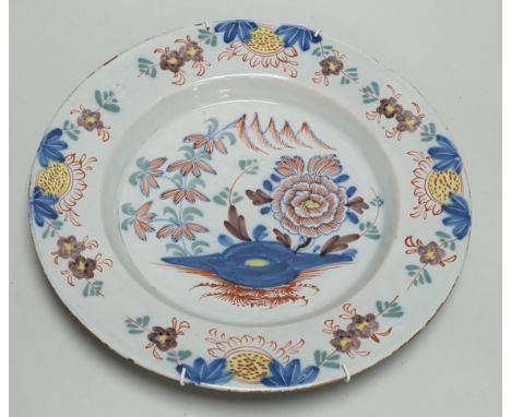An 18th century English delftware polychrome charger, 31cm