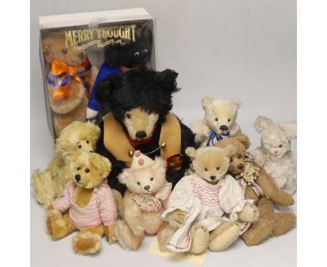 A Merrythought teddy and golly, boxed, with five artist's bearsThese items are listed on the basis they are illustrative of a