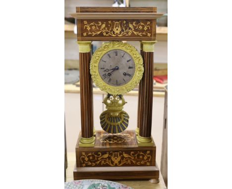 A French Charles X inlaid portico clock, 25.5cm wide, 52cm high