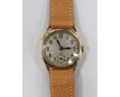A gentleman's 1930's? 9ct manual wind wrist watch, with Arabic dial, on a leather strap.