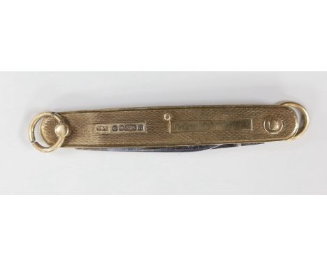 An engine turned 9ct gold cased penknife, 72mm.