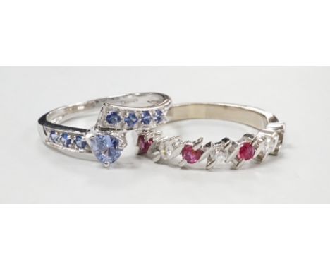 A modern continental white metal ruby and diamond set half hoop ring (ruby missing), size P and and a modern 18ct white gold 