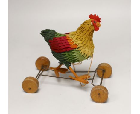 A Steiff cockerel on wooden wheel, c.1915, no button, good condition