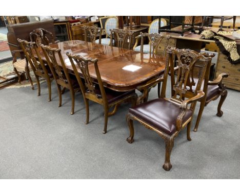 A reproduction inlaid mahogany twin pillar extending dining table, approx. 250cm extended, two spare leaves, width 110cm, hei