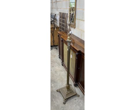 An Edwardian brass Corinthian column telescopic lamp standard