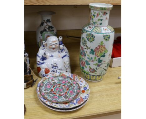 Two Chinese vases, three plates and a figure of Budai, tallest vase 44cm