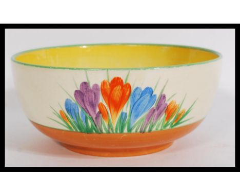 A vintage 20th century Clarice Cliff large fruit bowl in the Crocus pattern. Not signed but stamped for Wilkinson Pottery. Pl