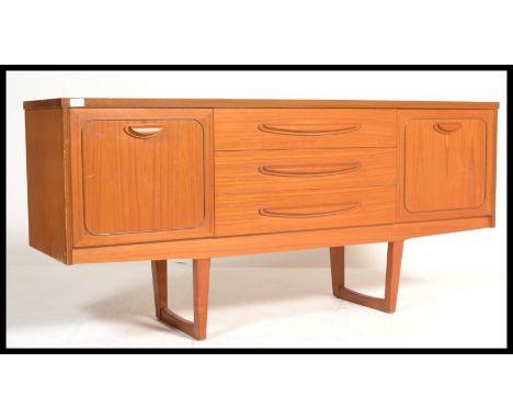 A vintage mid century teak veneer sideboard with 3 drawers to middle and doors on either side.&nbsp;Measures: 74cm high x 159