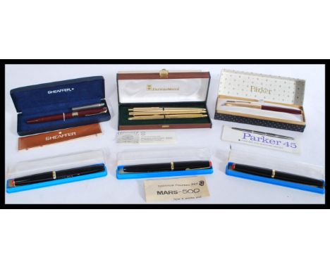 A group of vintage fountain pens to include three cased Staedtler pens a boxed Papermate pen , Boxes Parker pen and a 14k gol