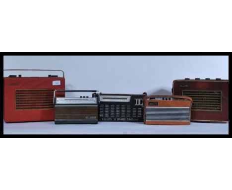A group of vintage radios to include two Hacker Heralds , Roberts Rambler , ITT Tiny Super , De Luxe etc. Highest measures 22