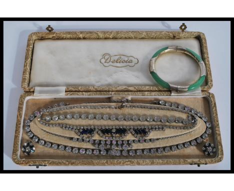 A vintage 20th century Art Deco white rhinestone and blue sapphire type rhinestone demi-parure necklace set consisting of nec