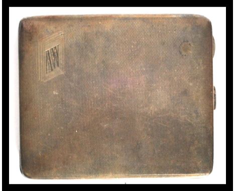 A silver hallmarked heavy cigarette case ( 138.4g ) with engine turned facia, monogram AW to corner with inscription within '