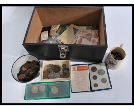 A collection of vintage coins dating from the early 20th century to include many pre decimal silver coins , along with some v