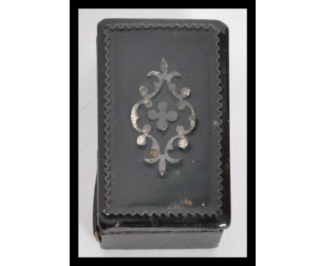 A 19th century papier mache miniature snuff / pill box of rectangular form with shaped relief decoration atop. Measures 1.5 c