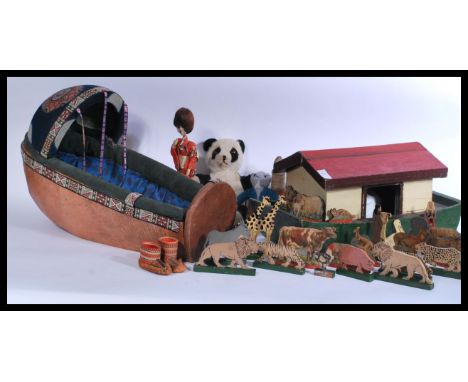 A mixed lot of vintage toys to include a wooden Noah's ark with wooden animals , Black Pedigree doll , panda and a Norwegian 