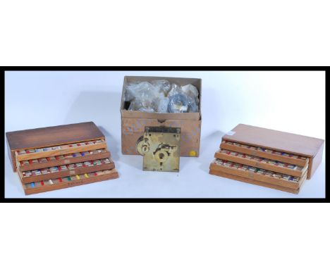 A pair of vintage watch makers / repairers small beehive fronted cabinets with contents together with an English Fusee moveme
