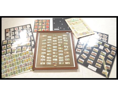 A Wills cigarette card advertising point of sale poster along with a quantity of framed and glazed sets , framed sets and unc