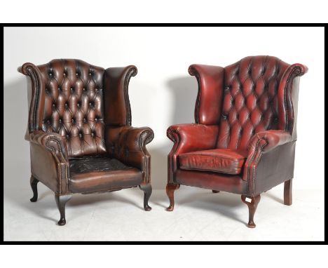 A good pair of Oxblood Chesterfield button back wing armchairs being raised on cabriole legs with pad feet, buttoned back lea