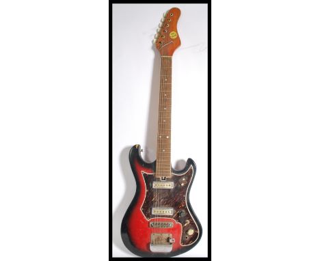 A vintage Teisco Top Twenty six string electric guitar having a shaped flame body. Measures 98.5 cm high.