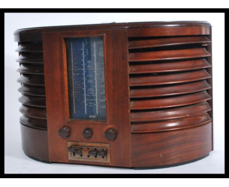 A vintage early 20th Century GEC large mahogany cased valve radio Model No BC4750 D shaped case with rounded louvred sides wi