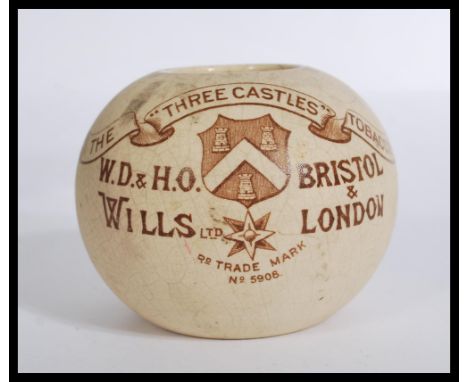 A vintage early 20th century WD &amp; HO Wills Bristol &amp; London cigarette match striker for three castles tobacco and cap