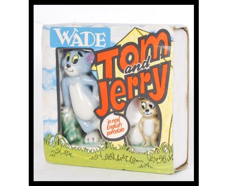 A vintage retro Wade porcelain Tom &amp; Jerry figure set in original packaging. Highest measures 9 cm.