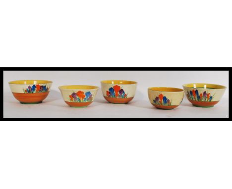 A group of five vintage 20th century Clarice Cliff bowls in the Crocus pattern. The bowls of varying form and sizes. Please s