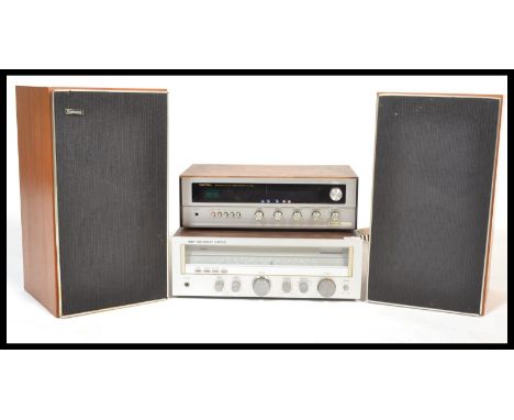 A vintage Rotel Solid State teak cased AM / FM Stereo Receiver RX - 200A together with&nbsp; a teak cased G &amp; C A1800-A t
