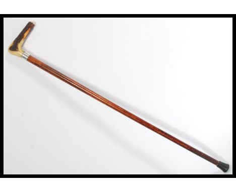 A 19th century Victorian silver hallmarked walking stick cane. The tapering Malacca shaft having a shaped horn handle with Lo