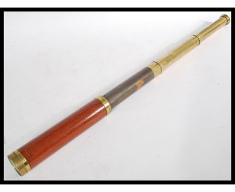 A vintage early 20th century Cary of London three draw brass telescope signed Cary with partial leather case. Measures 76 cm 