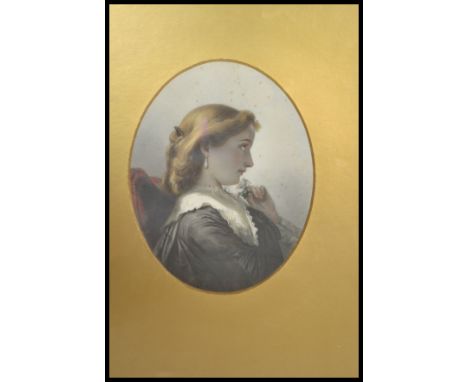 An Edwardian 1911 coloured lithograph print of a portrait bust study of a maiden being dated to the reverse, framed and glaze