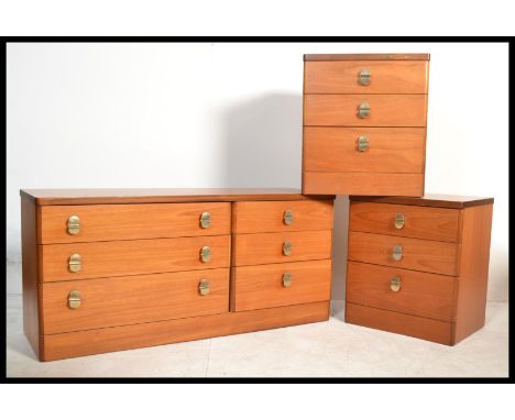 Stag Furniture - a pair of vintage 20th century teak wood bedsides along with a double chest unit having two drawers next to 