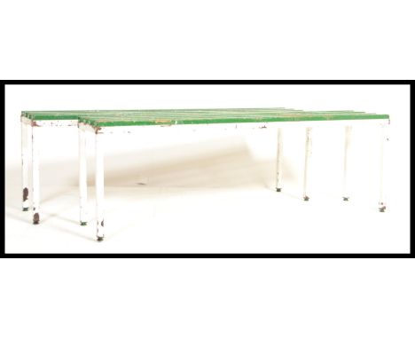 A pair of vintage 20th century Lilo / Tennis sports benches, raised on a metal tubular frame having slated wooden top painted