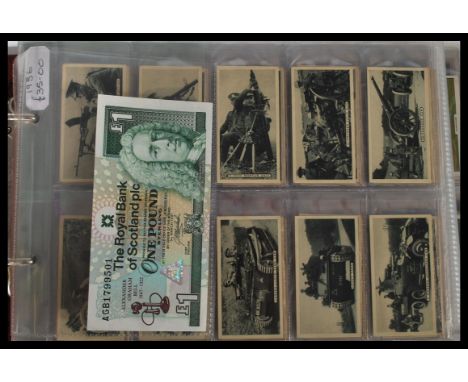 An album containing a collection of vintage cigarette cards dating from the early 20th century to include Britains Defenders 