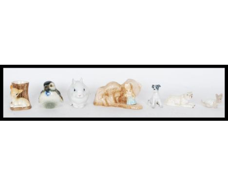 A Royal Copenhagen figurine of a white rabbit&nbsp;no. 4705 by Jeanne Grut. Painted marks to base. Along with a group of cera