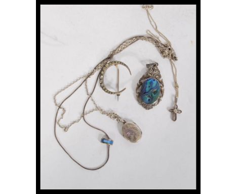 A collection of silver jewellery to include a vintage paste set crescent moon brooch, an abalone set pendant, a locket pendan