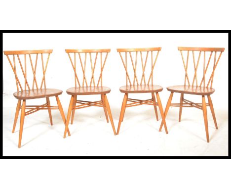 A set of four fantastic vintage mid 20th Century Ercol Windsor beech and elm cross back candlestick dining chairs, solid seat