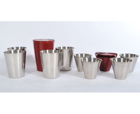 2 cased vintage sets of stainless steel Danish hunting - toddy drinking cups of graduating form set to burnished red leather 