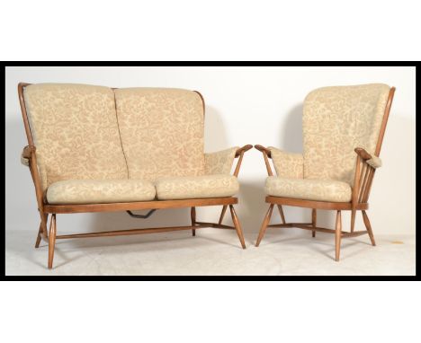 A vintage / retro 20th century Ercol Windsor two seater settee / sofa together with a matching armchair complete with the ori