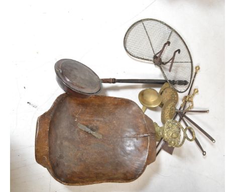 A large collection of antique vintage brass wares to include part companion set , chestnut roaster , pumpkin candlestick hold