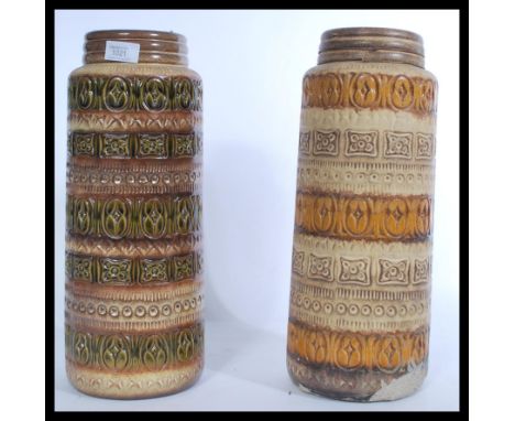 A pair of vintage retro 20th century West German ceramic fat lava style vases of tall form. Highest measures 42 cm.