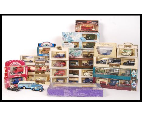 An assorted collection of original boxed Lledo Days Gone By diecast scale model advertising vehicles to include Post Office T