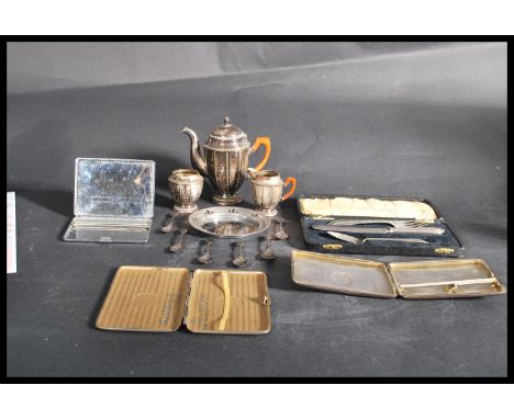A good group of vintage silver plate to include a miniature three piece tea service , a set of six tea spoons by John Sherwoo