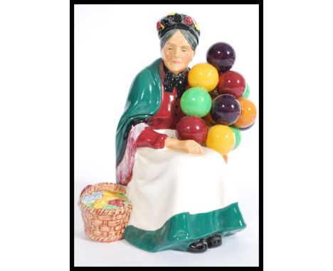 A vintage 20th century Royal Doulton ' The Old Balloon Seller ' HN1315 ceramic figurine, 20cm high with early Royal Doulton s