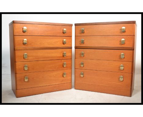 A pair of vintage 20th century Stag chest on chest of drawers. Fixed two over three figuration in teak wood.&nbsp;Measures: 9